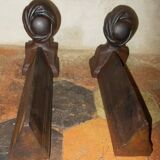 Old cast iron andirons with oriental decor