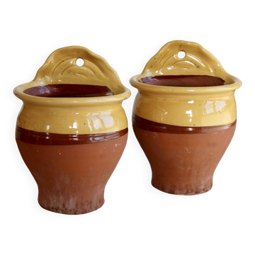 Pair of vintage wall planters in yellow glazed stoneware.