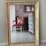Wood and gilded stucco mirror, 19th century, 115 x 61.5 cm.