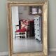 Wood and gilded stucco mirror, 19th century, 115 x 61.5 cm.
