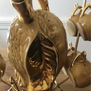 Service à liqueur en barbotine noix par la maison Louis Roque