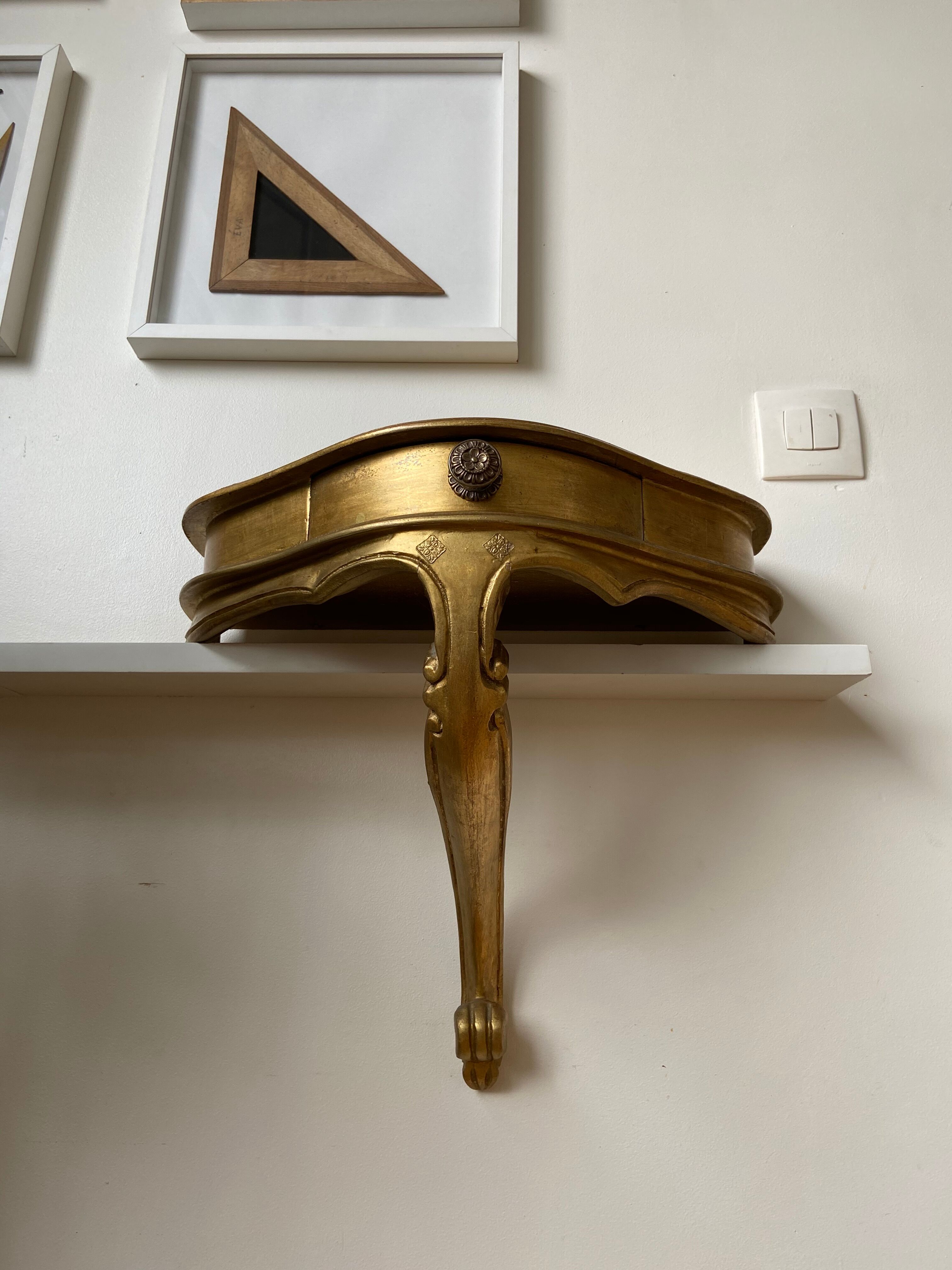 Gold wall shelf with drawer