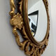 Ancient witch's eye mirror Dollanzo Italy in gilded wood