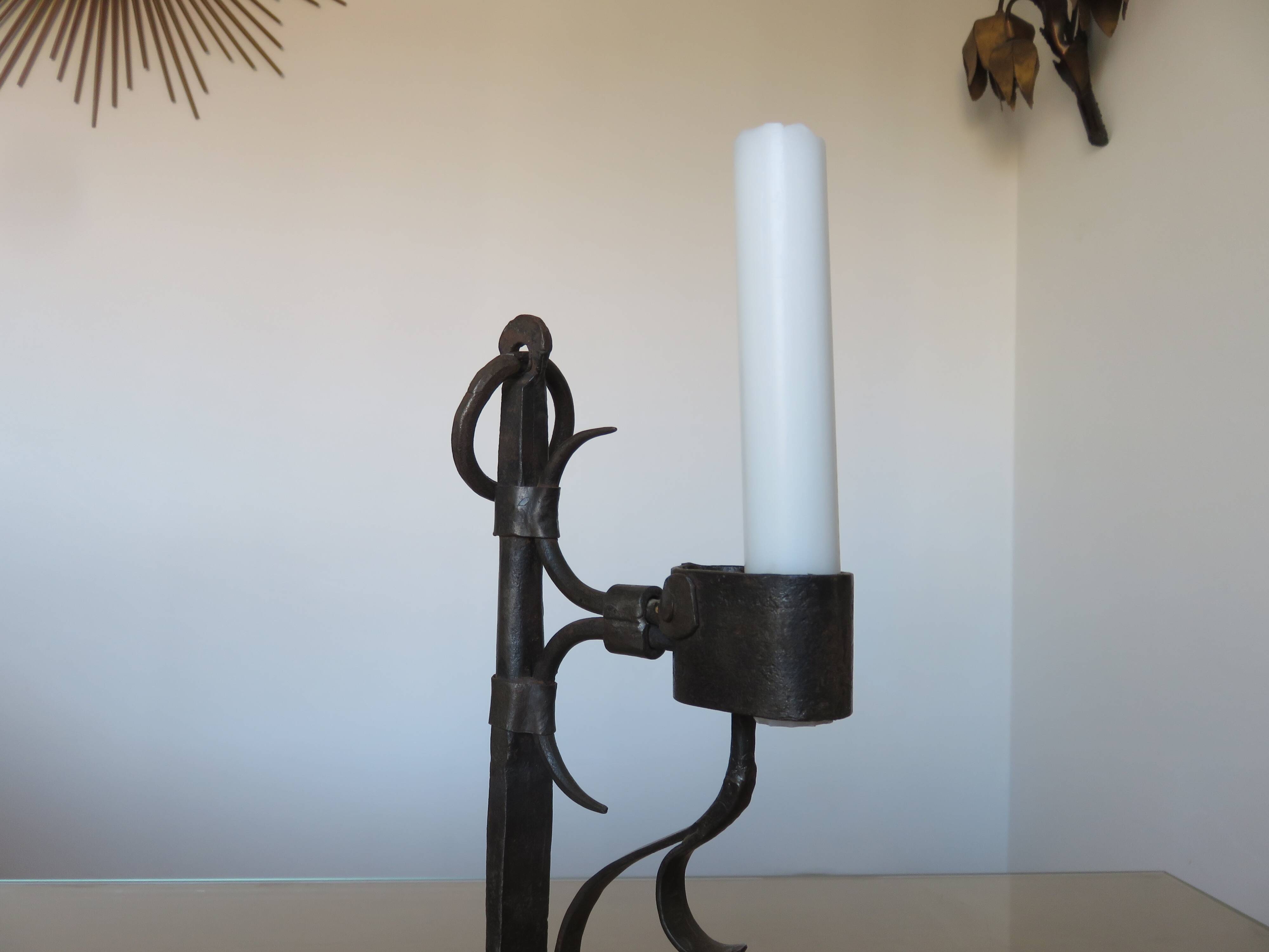 Brutalist candlestick in blackened wrought iron from the 1940s-50s.