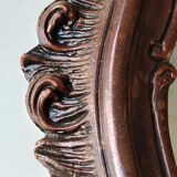 Pretty Baroque style mirror / Louis XV patinated with pink / golden copper reflections. Volutes, leafy shells