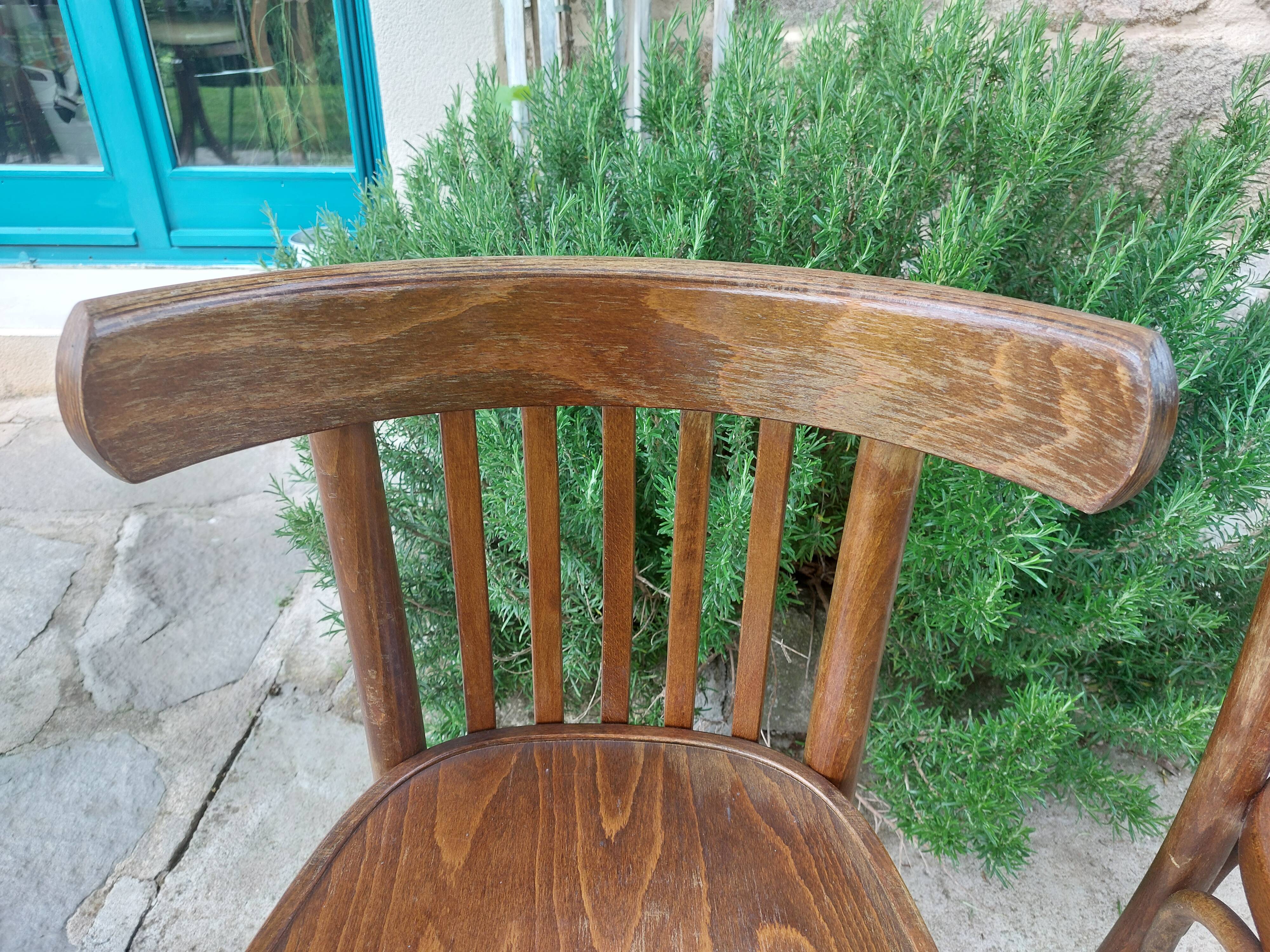 pair of dark bistro chairs, rounded backs, Baumann style