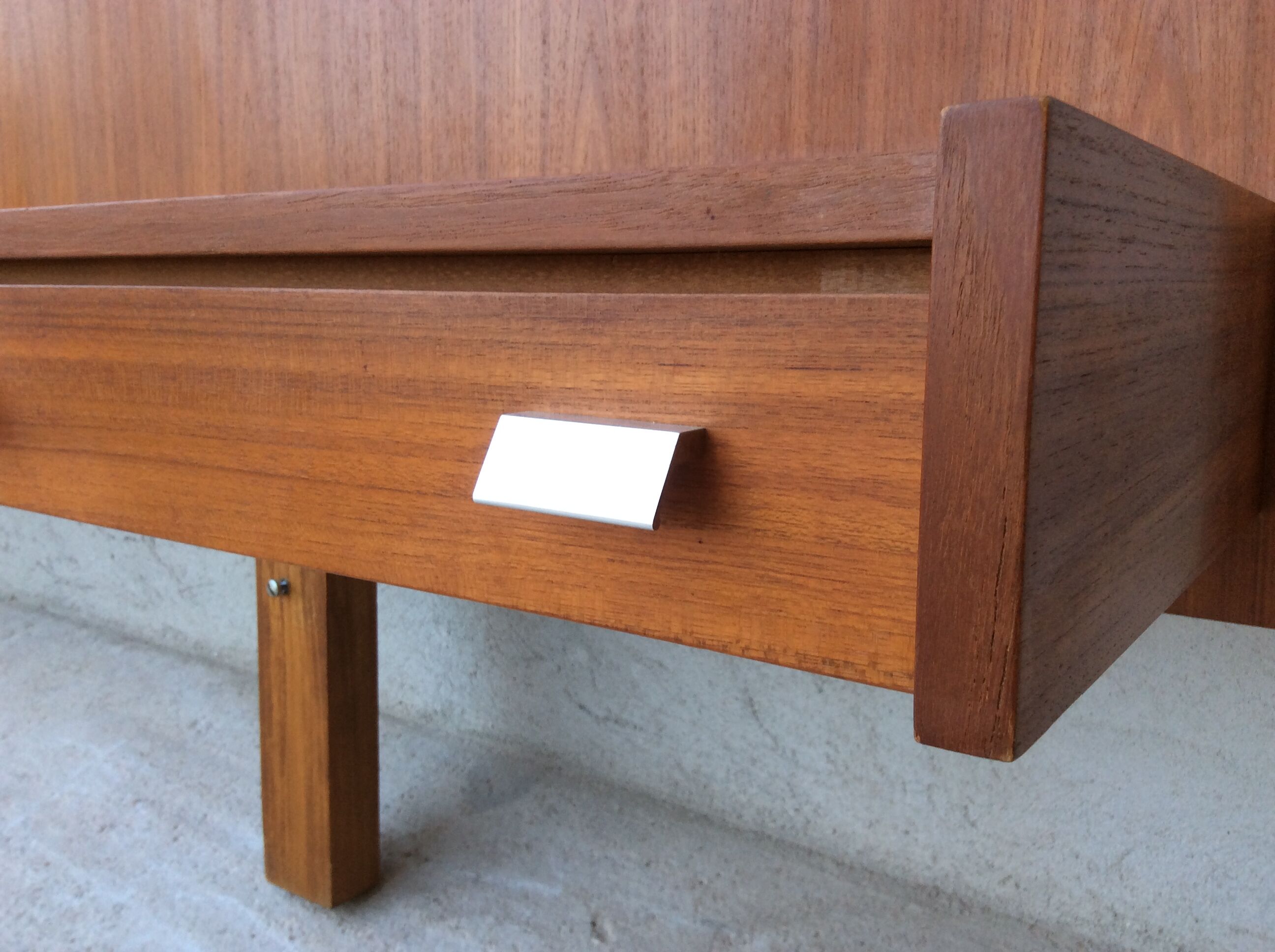 Scandinavian-style teak bed with integrated nightstands