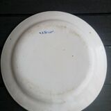 Signed plate on the back of Saint Clement decorated with bouquet of flowers