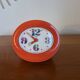 Vintage mechanical alarm clock in orange plastic Uti West Germany