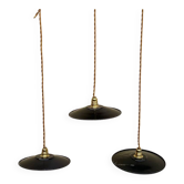 Trio of vintage black and white enamelled sheet metal pendant lights, industrial style