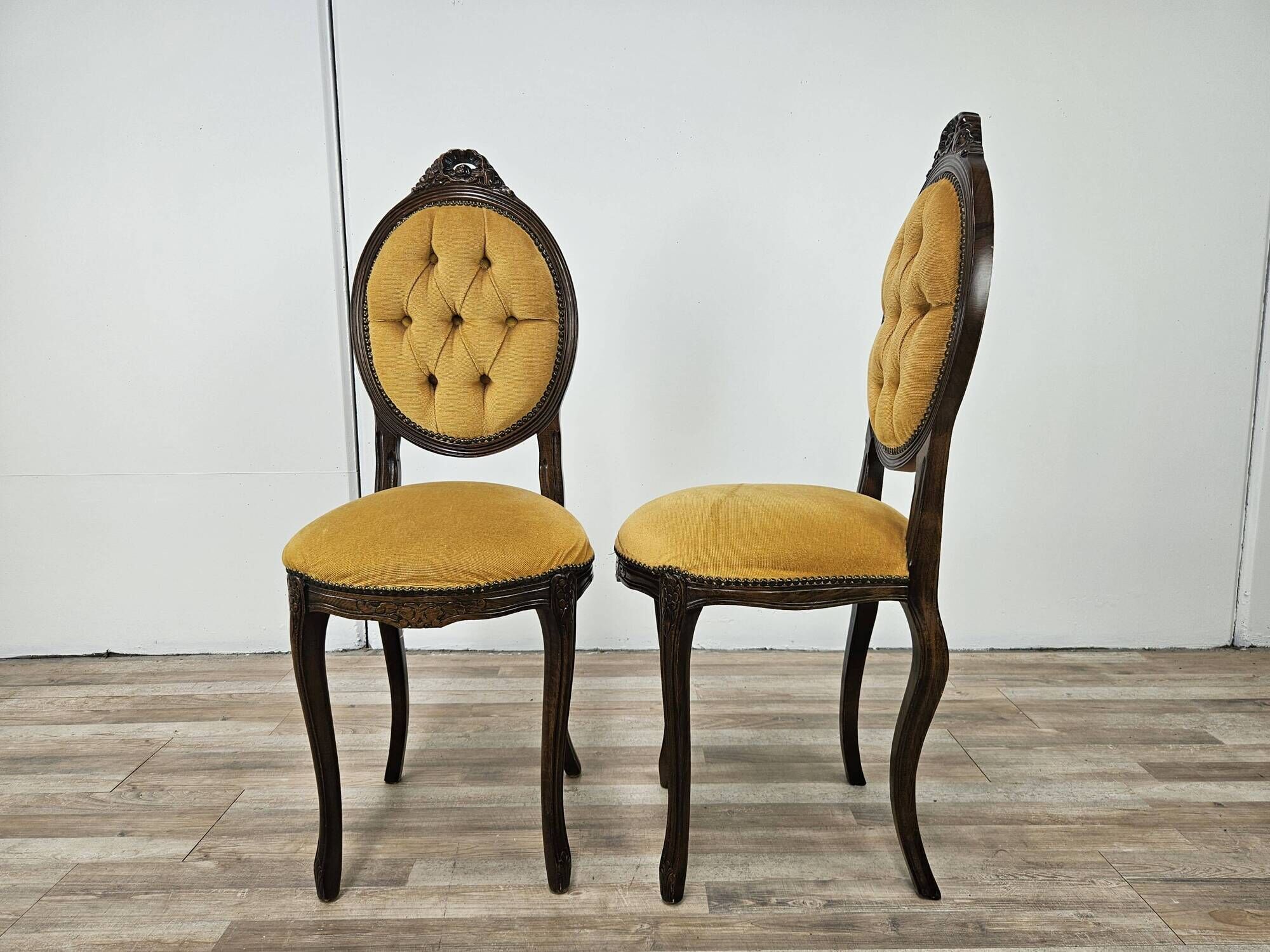 Pair of early 1900s wooden chairs with padded seat and backrests