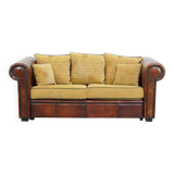 Luxurious and spacious two-seater sheepskin sofa of top quality with fabric cushions