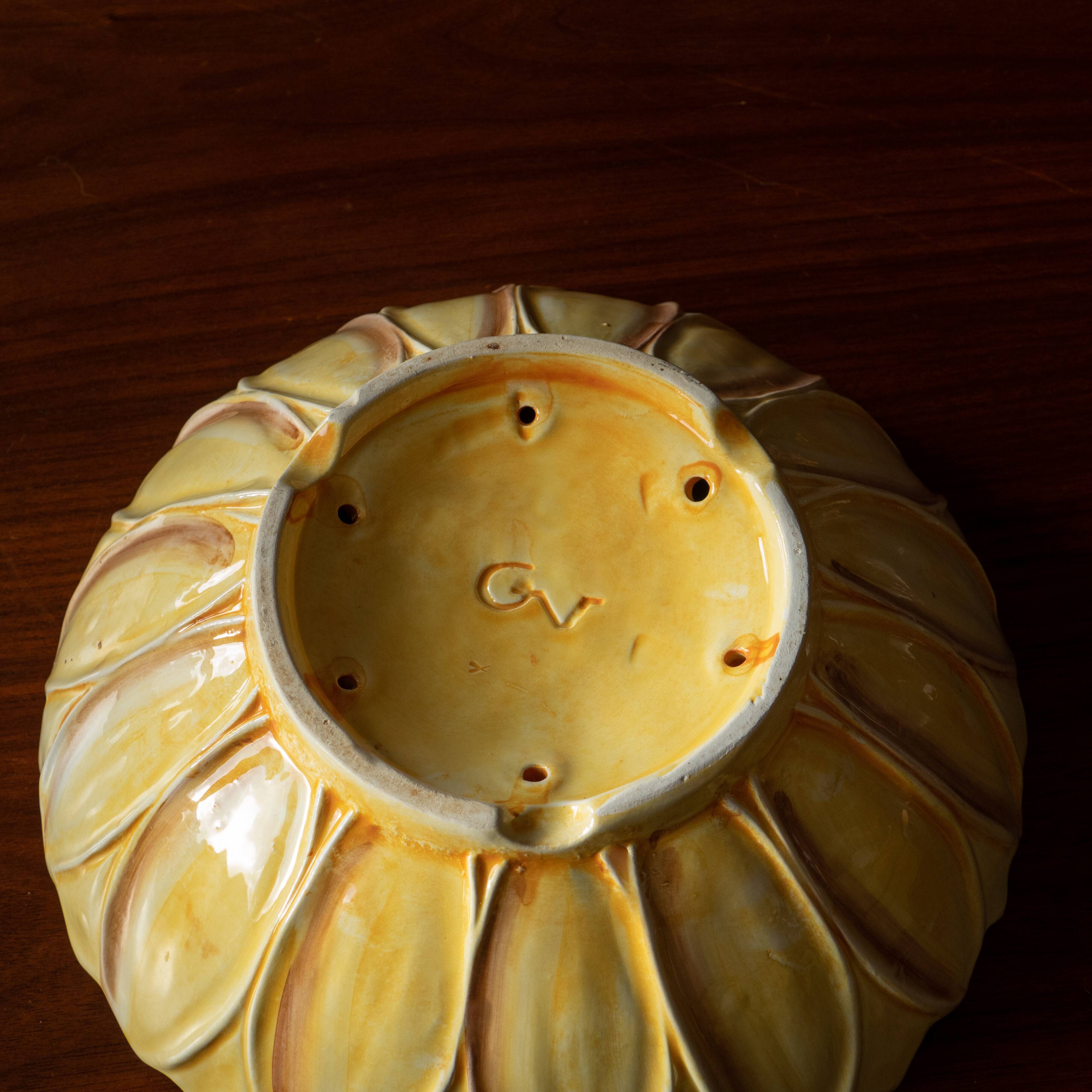 Old drainer in sunflower slip signed GV