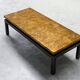 Modernist coffee table with a patinated gold top, 120x52.5x36 cm, mid-20th century.