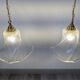 Pair of granite glass and brass pendant lights – poetic elegance