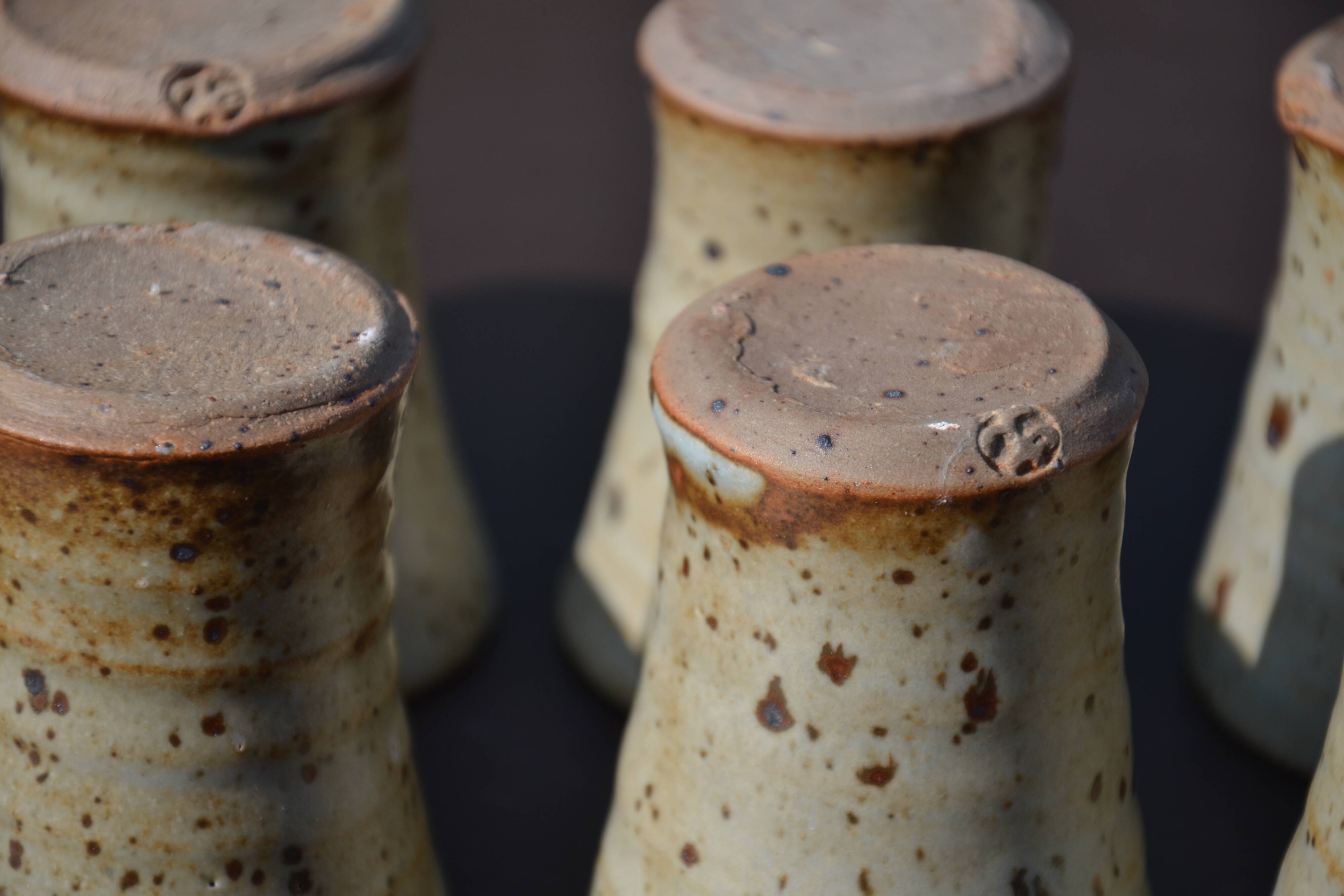 8 stoneware cups/mugs by Gustave Tiffoche