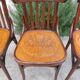 4 bentwood bistro chairs with a pattern on the seat