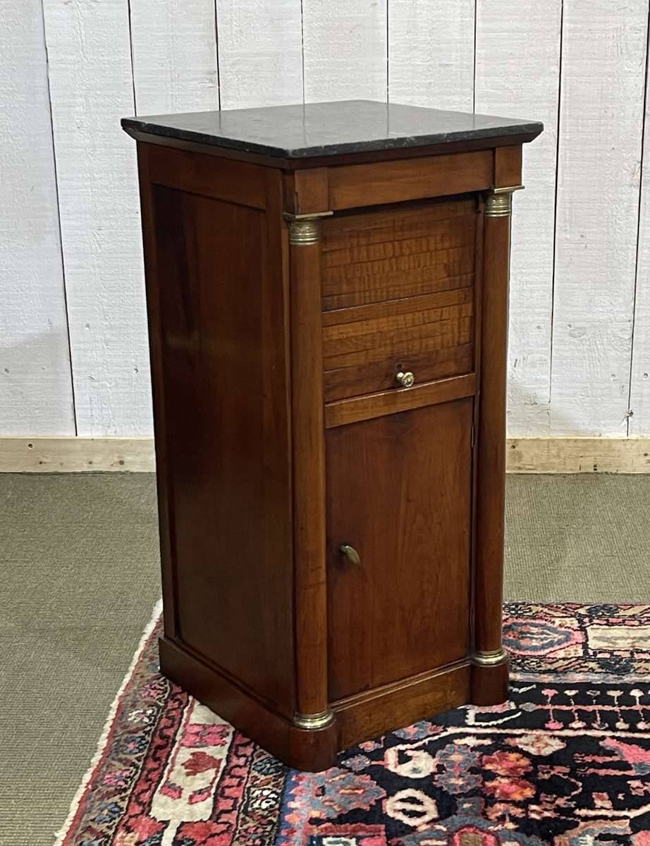 Empire bedside table from the 19th century in cherry wood and black marble.