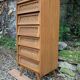 Vintage rattan chest of drawers with splayed legs from the 1950s.