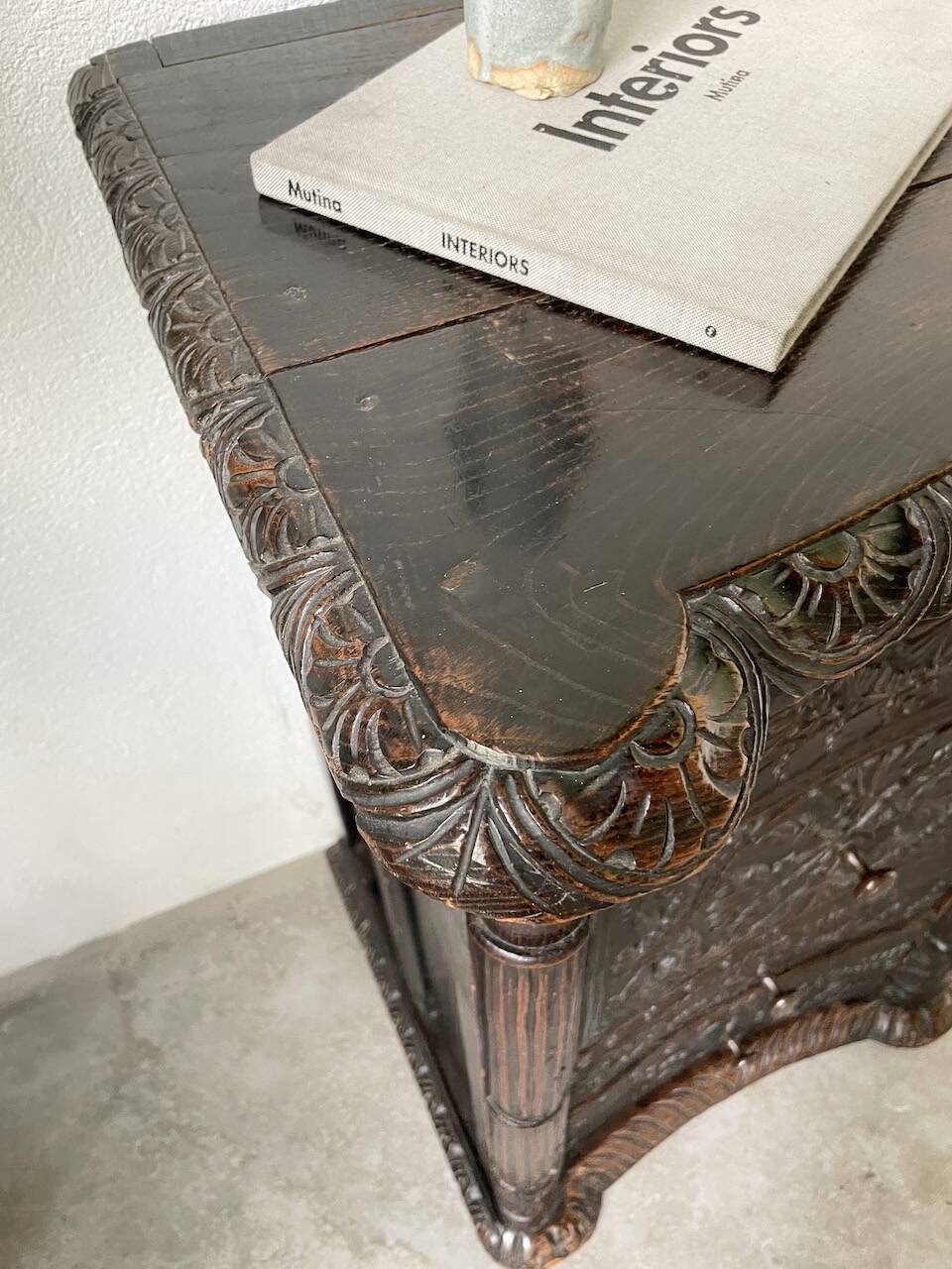 19th century chest of drawers in carved blackened pine