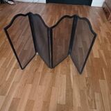 Metal fireplace screen made up of 4 leaves