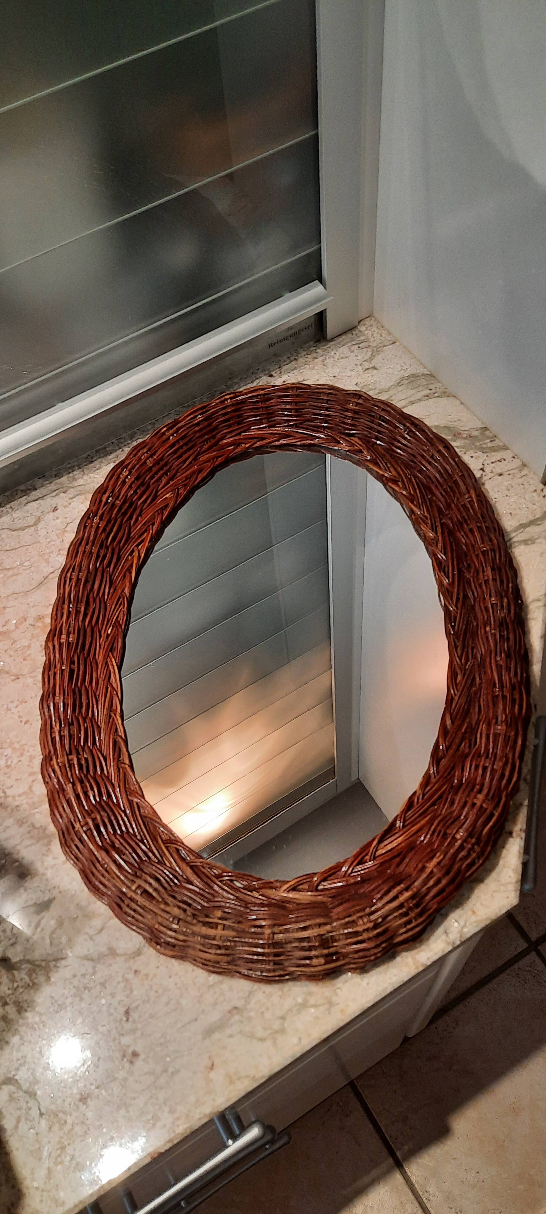 Vintage woven wicker oval mirror