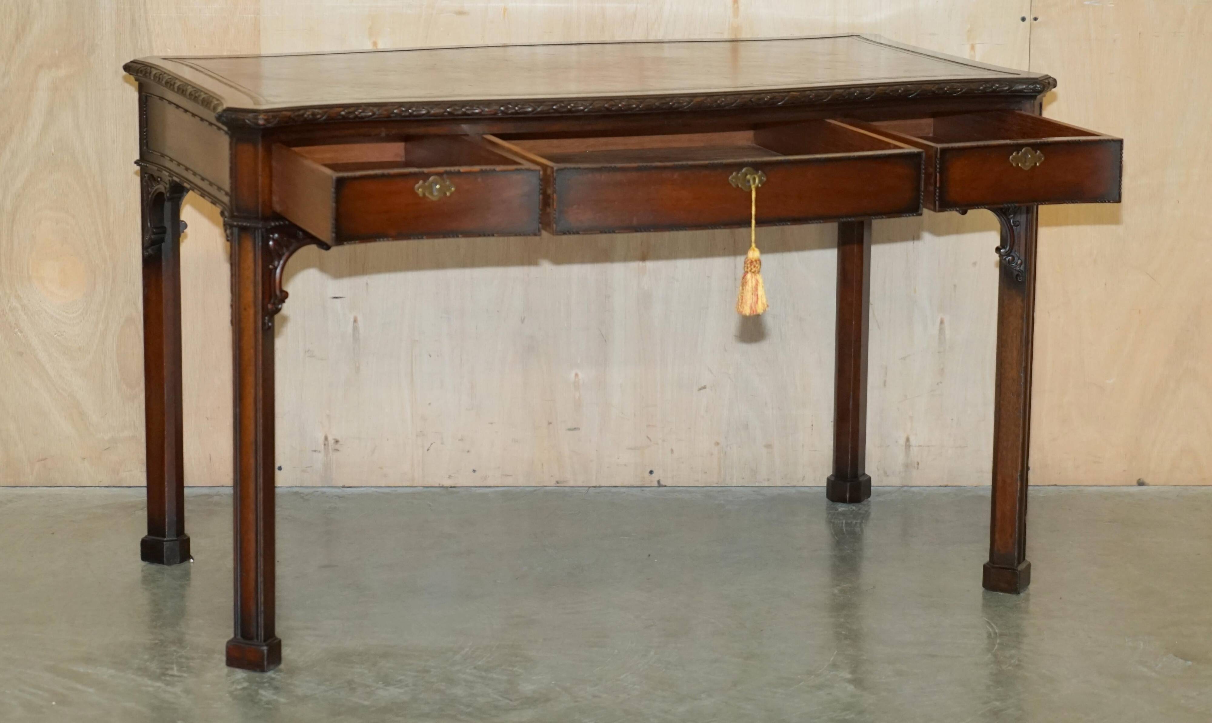 WARING & GILLOW library desk in the style of Thomas Chippendale with a leather top.
