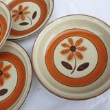 Set 11 plates 1970 Revernay Sarreguemines orange and brown on sandstone background