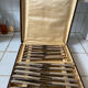 Box of silver metal knives