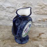 Blue ceramic vase with floral motifs