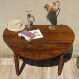 Antique walnut table with drop-leaf doors