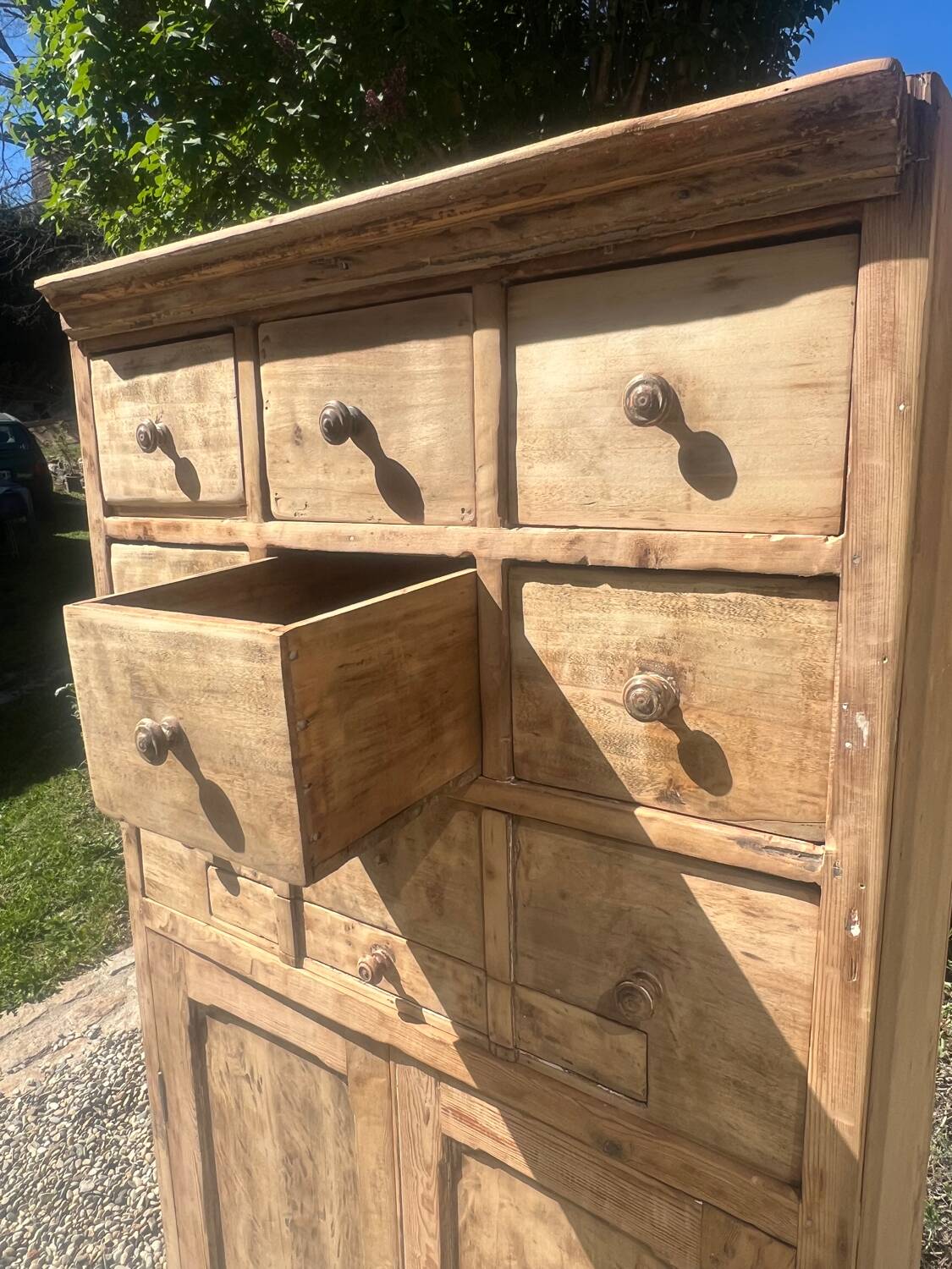 Beautiful piece of furniture with 8 drawers/2 doors in raw wood.