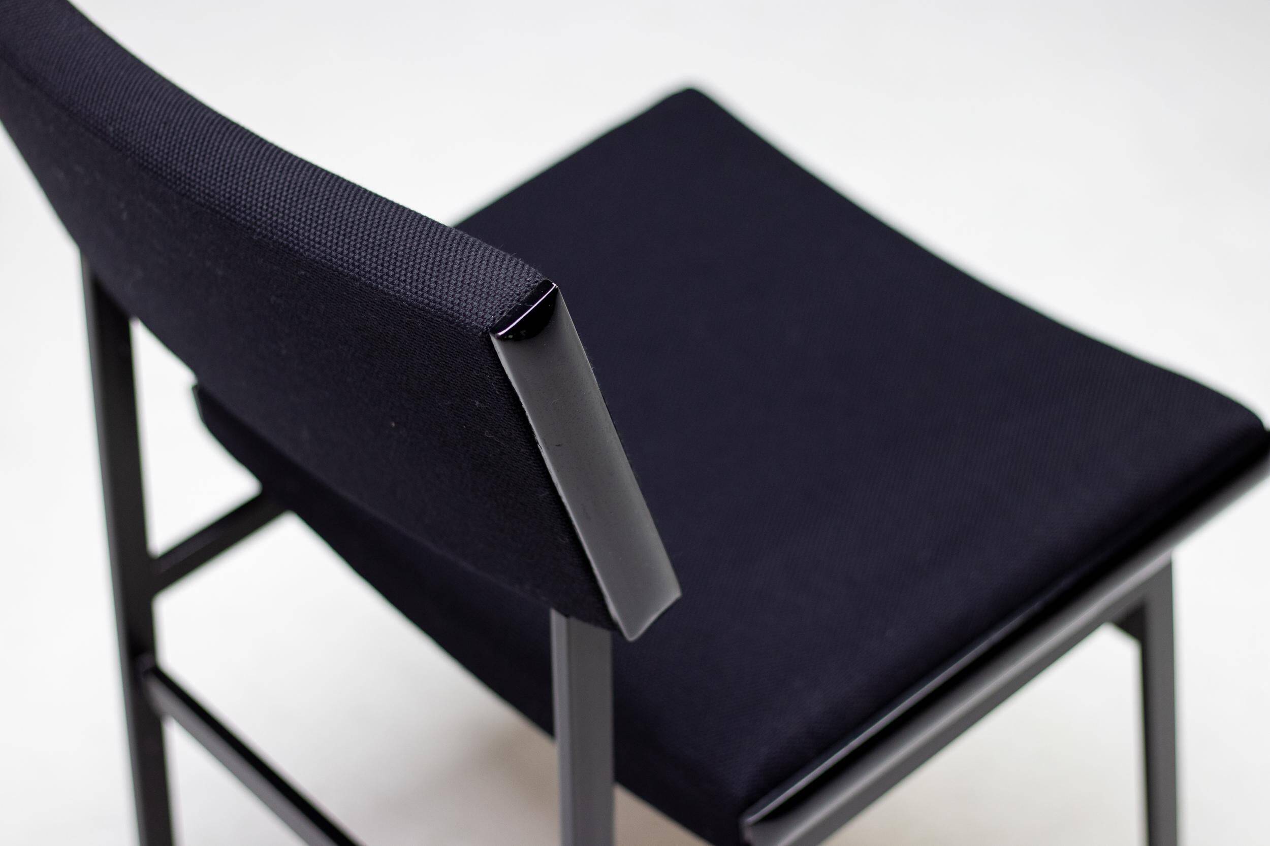 Set of four entirely black Hulmefa dining chairs, Architectural Modernism.