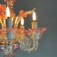 Small Venetian chandelier in colorless and red Murano glass, circa 1950