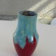 An emailed ceramic vase in turquoise and red, design and vintage