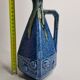 Art Deco pitcher in blue enamelled sandstone with fruit decoration, 22 cm