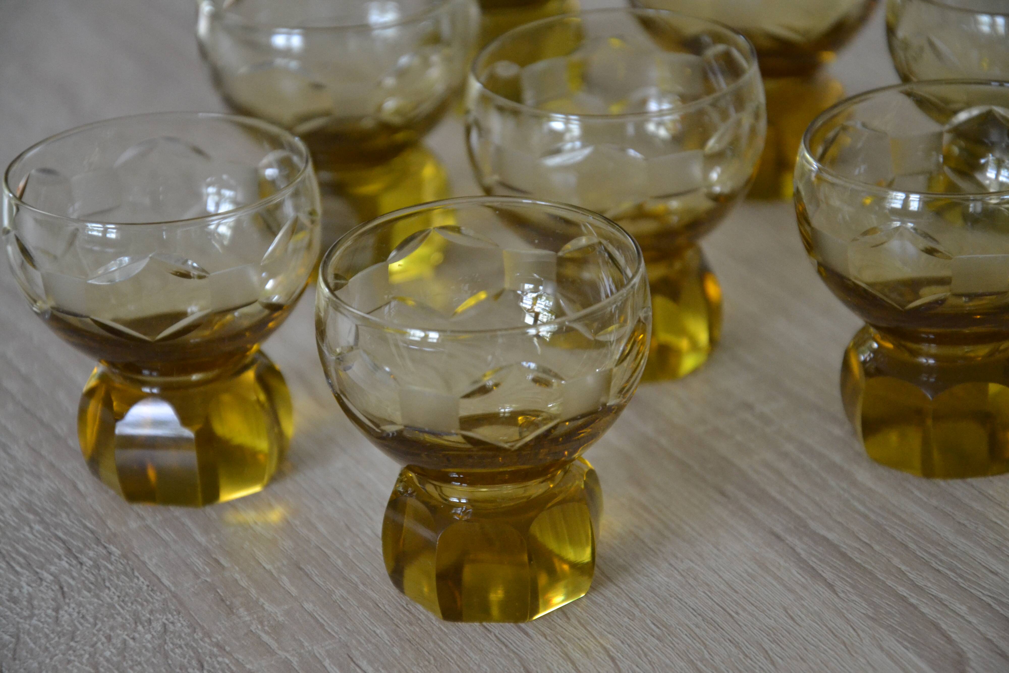 9 small amber art deco glasses