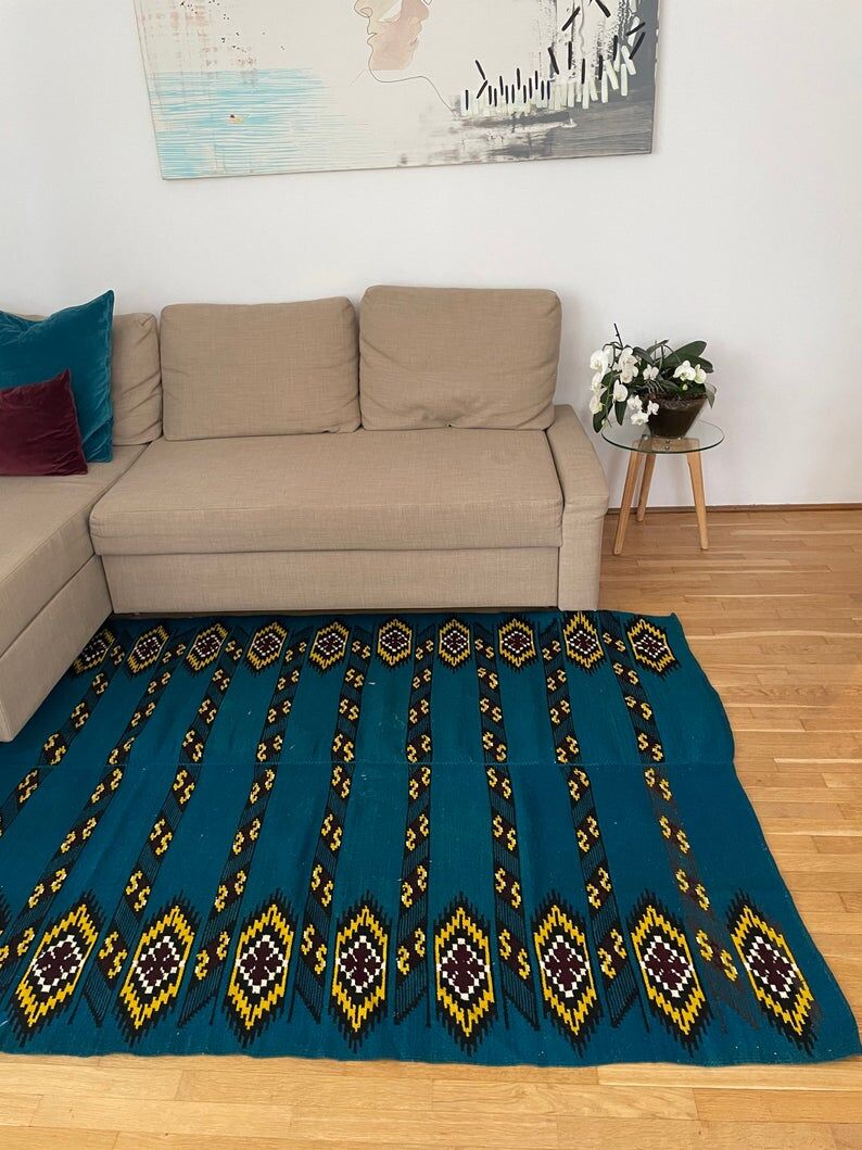 Romanian handwoven carpet with blue ground and yellow details