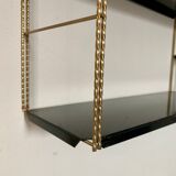 Vintage wall shelves in gold and black metal