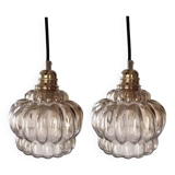 Set of two amber glass pendant lights