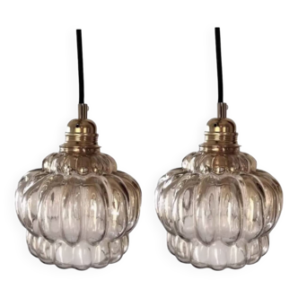 Set of two amber glass pendant lights