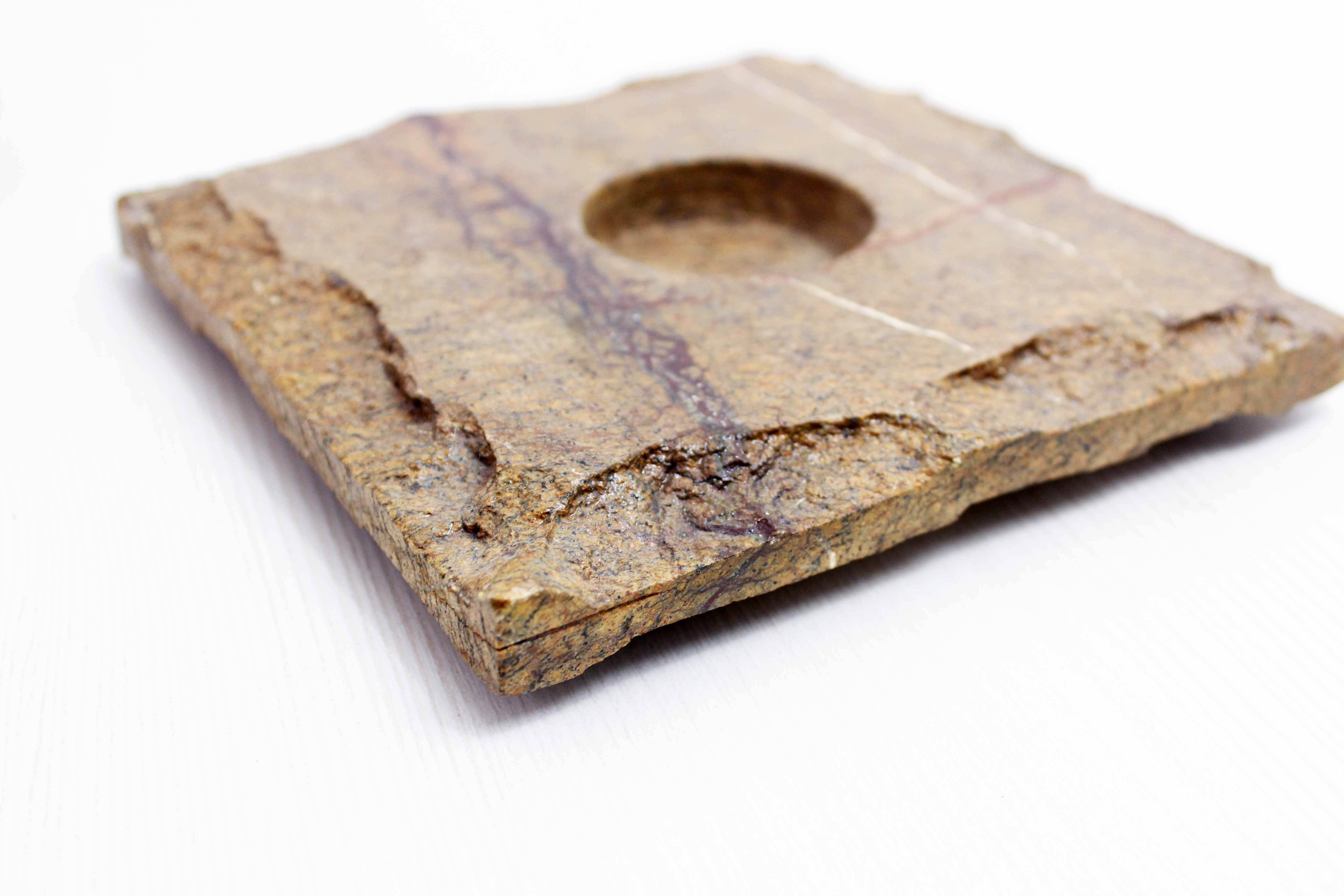 Pair of brutalist travertine candle holders