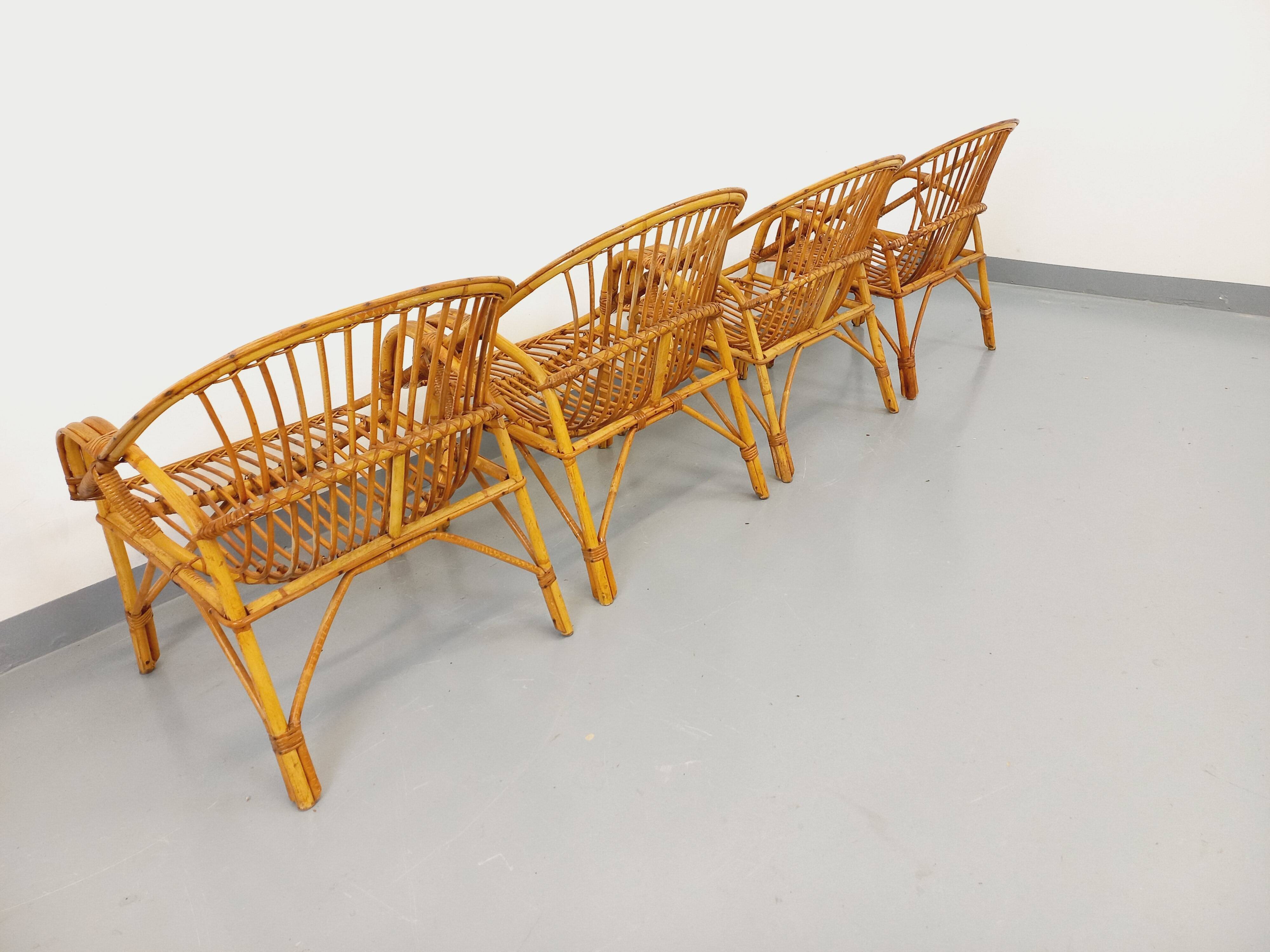 Set of 4 vintage rattan armchairs from the 60s