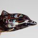 Stylised fish, decorated with colourful patterns on a dark background.