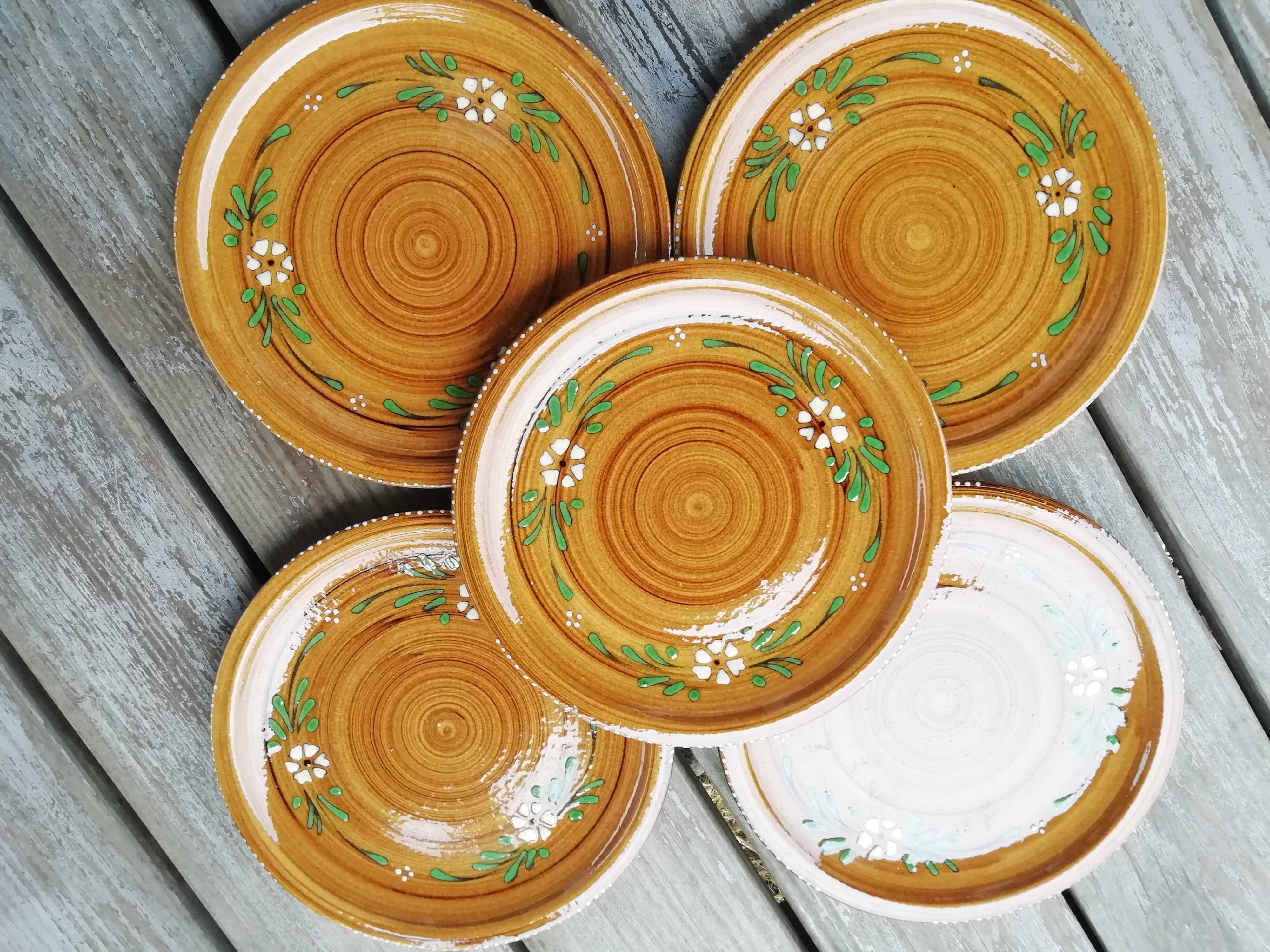 Set of glazed ceramic plates