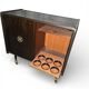 Vintage 50s-60s bar cabinet with tufted upholstery and lighting.