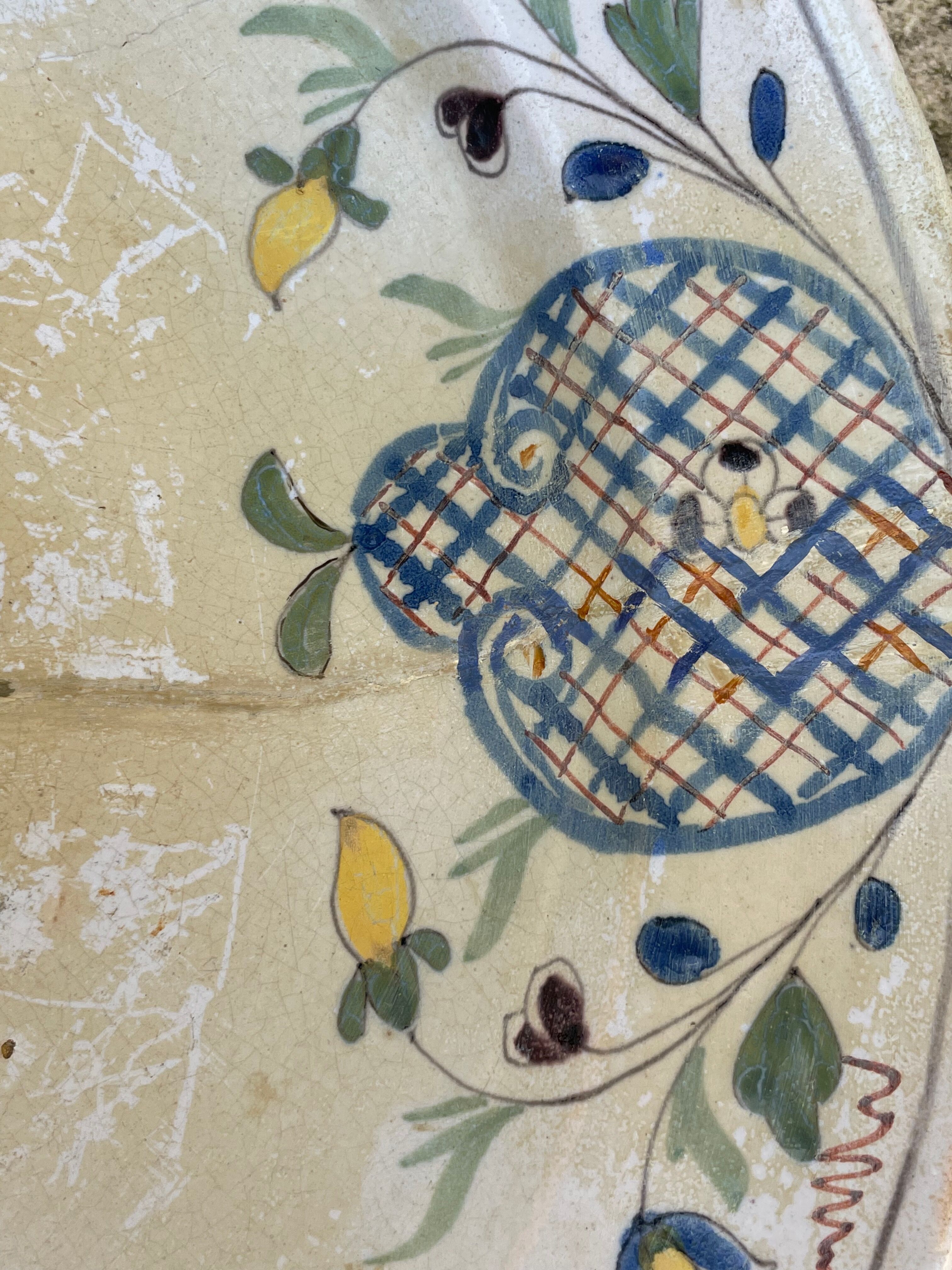 Restored antique dish with floral motif