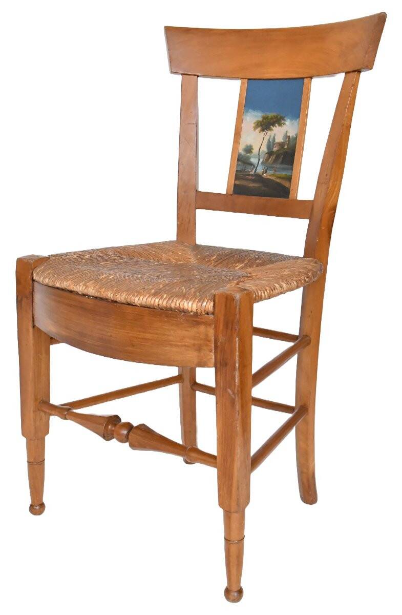 Pair of chairs with slatted backs and painted bands depicting animated landscapes.