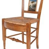 Pair of chairs with slatted backs and painted bands depicting animated landscapes.