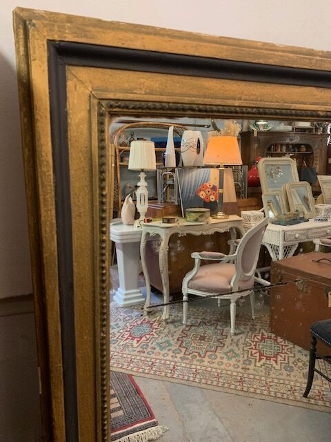 Giled and black fireplace mirror